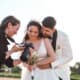wedding photographer with a profesional camera shooting bride and groom